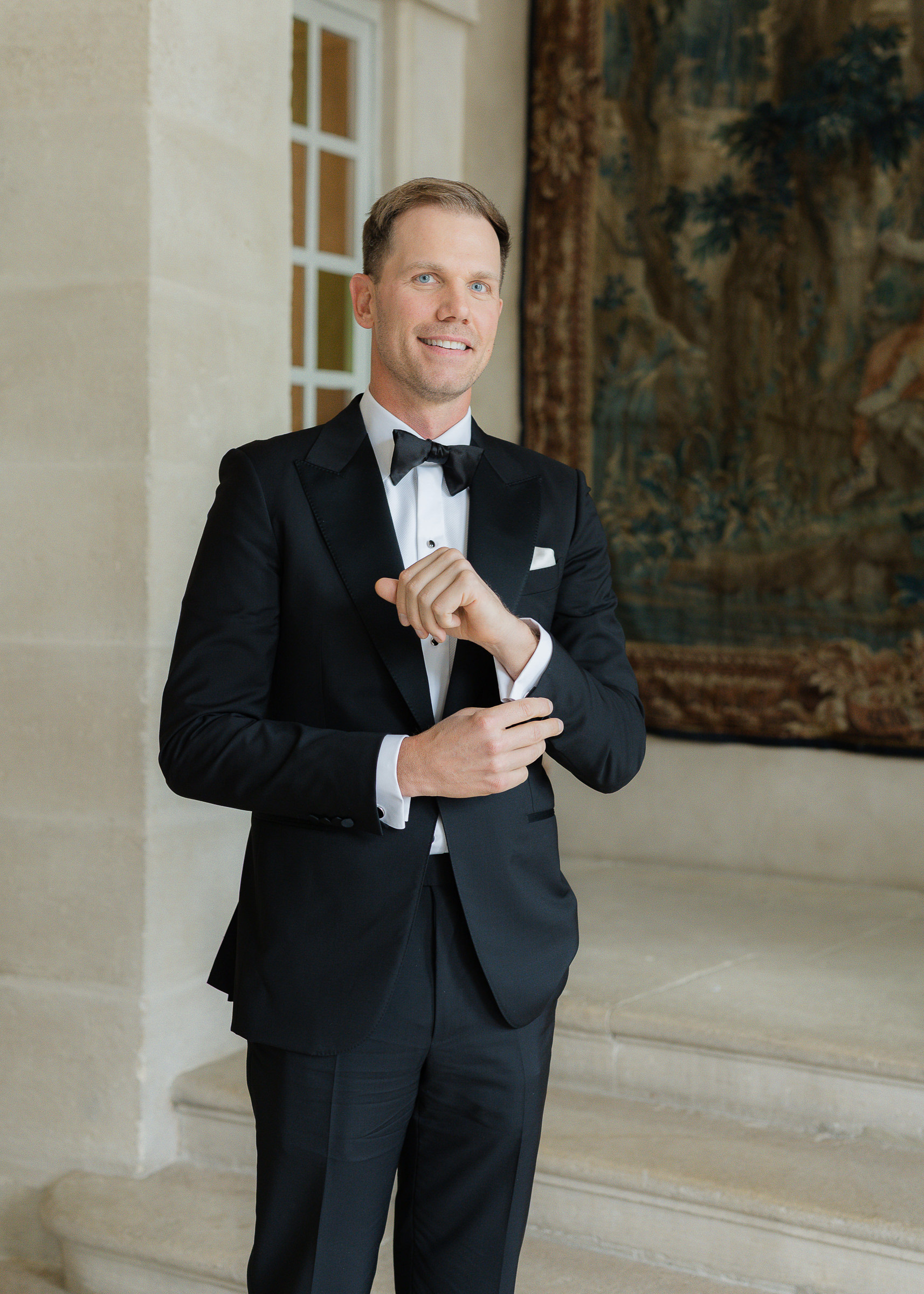 Groom getting ready at Château Villette before her wedding ceremony in Paris
