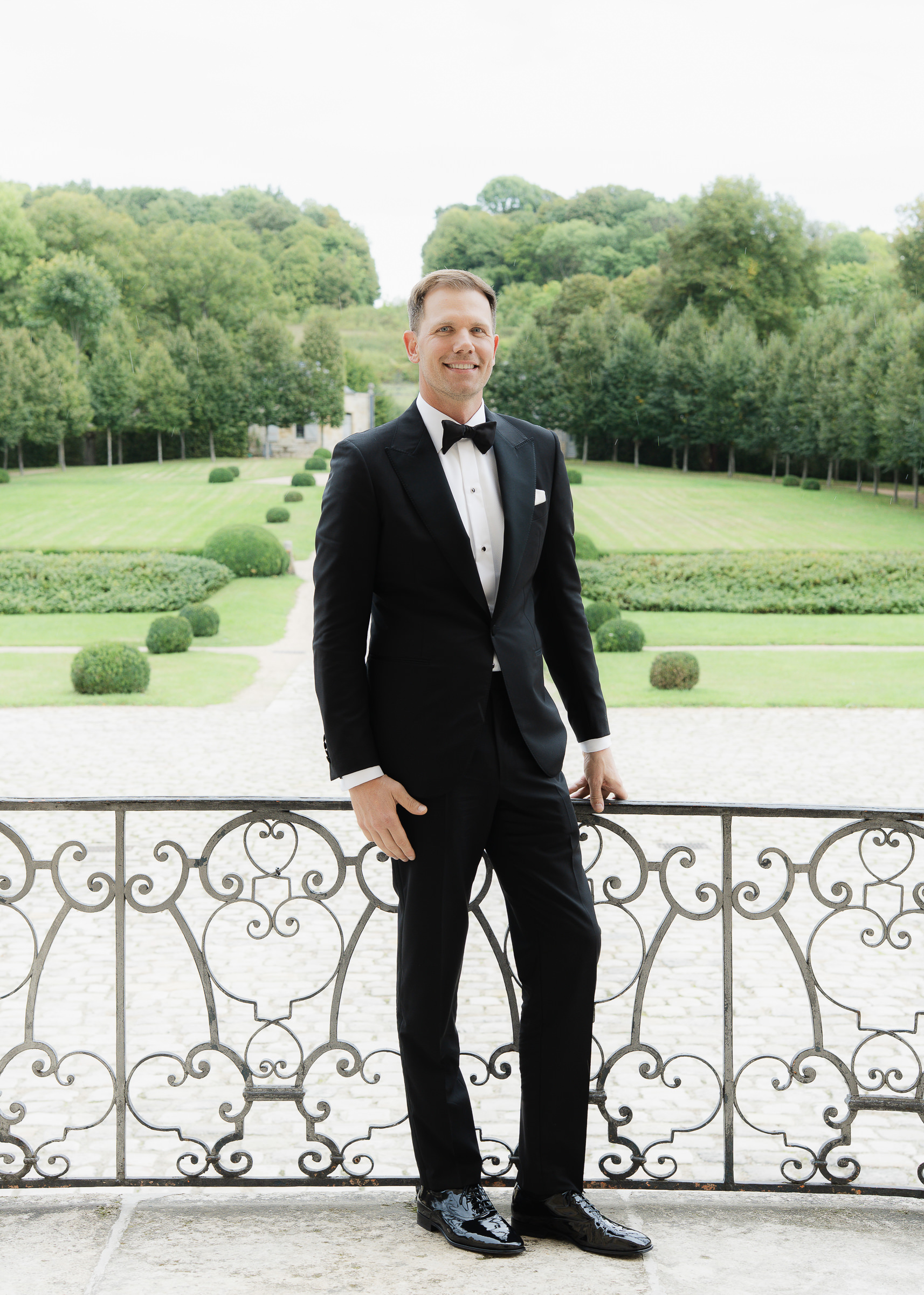 Groom getting ready at Château Villette before her wedding ceremony in Paris