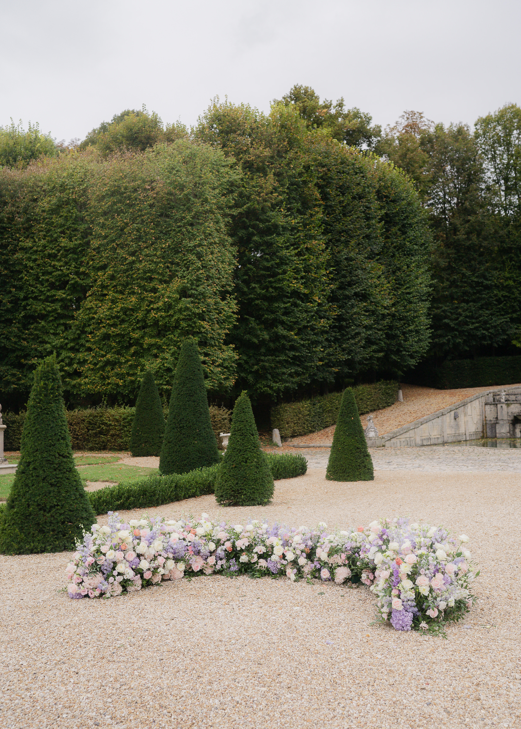 Floral arrangements and décor details at Château Villette French wedding ceremony