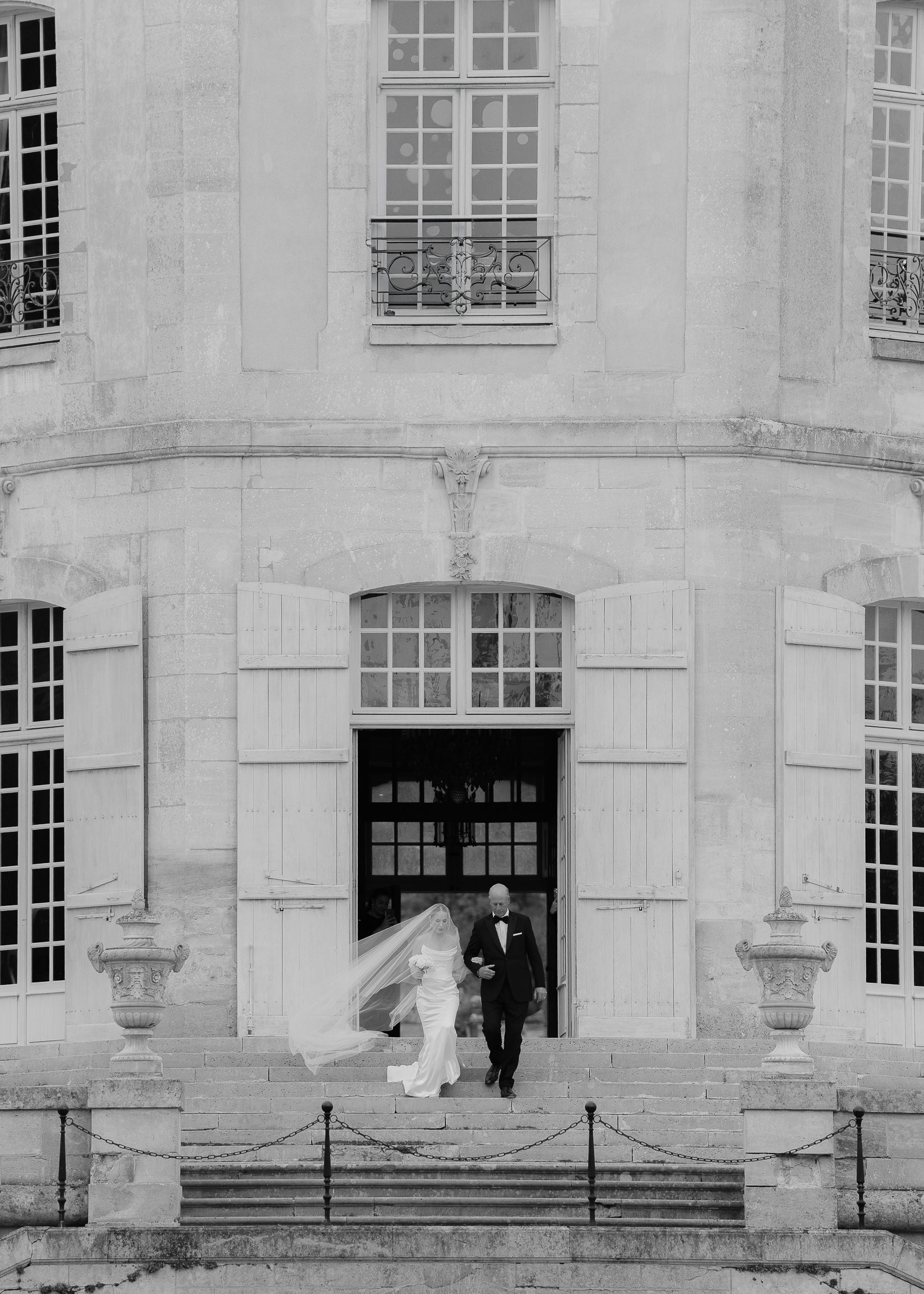Bride walking down the aisle with father at Château Villette intimate wedding in Paris