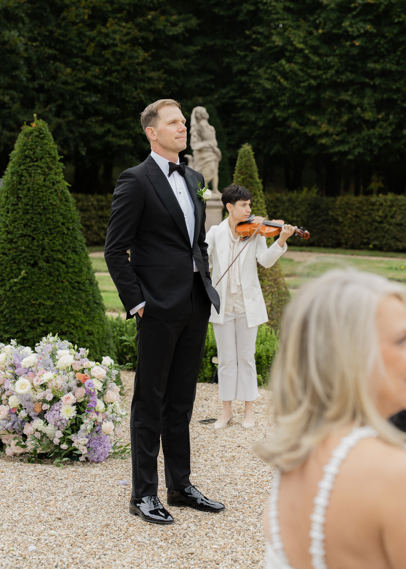 Groom waiting at the aisle for bride at Château Villette intimate wedding in Paris