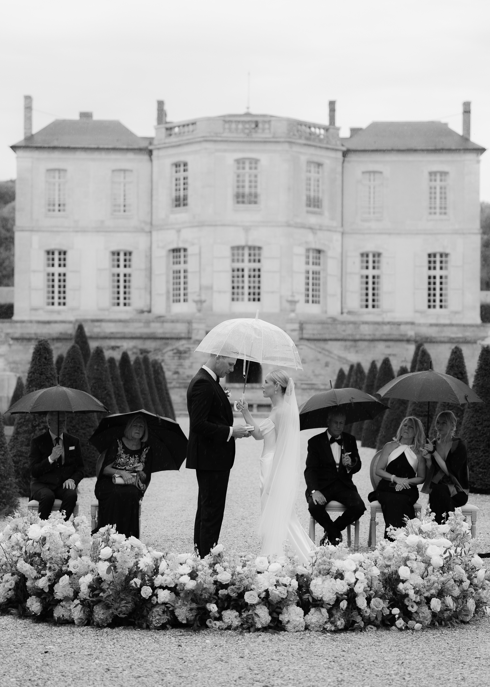 Romantic rainy ceremony at Château Villette, Paris destination wedding photographer