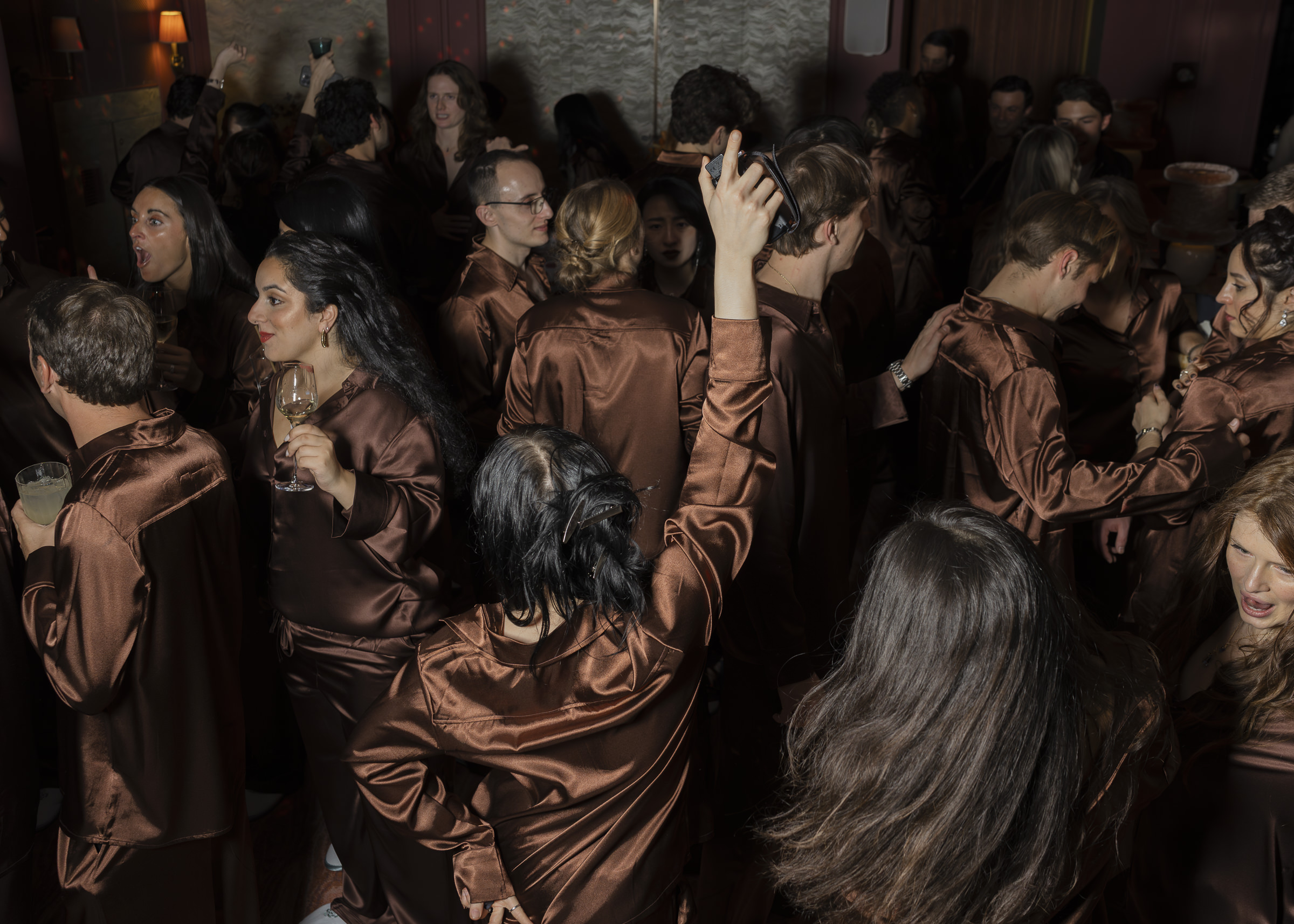 Guests dancing in matching PJs at an intimate Paris wedding