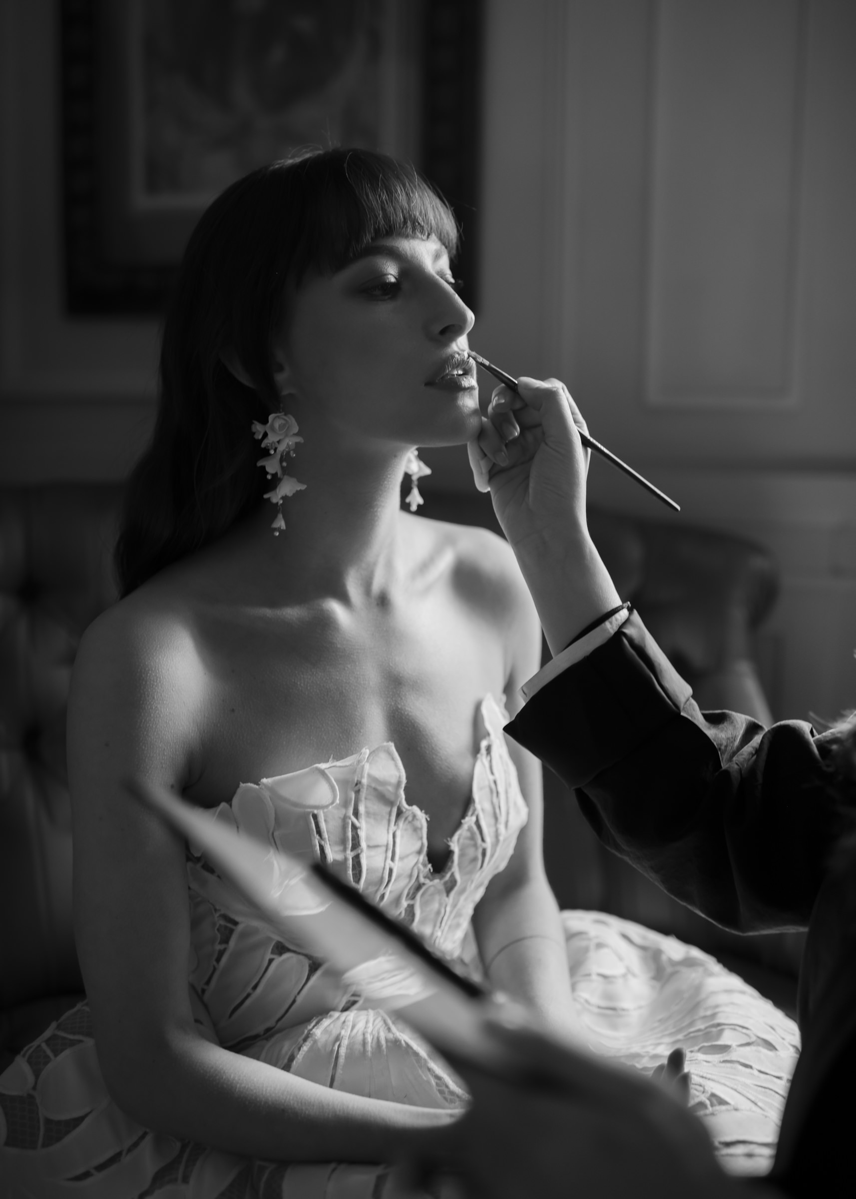 Editorial bridal preparation portrait with makeup artist in a French château