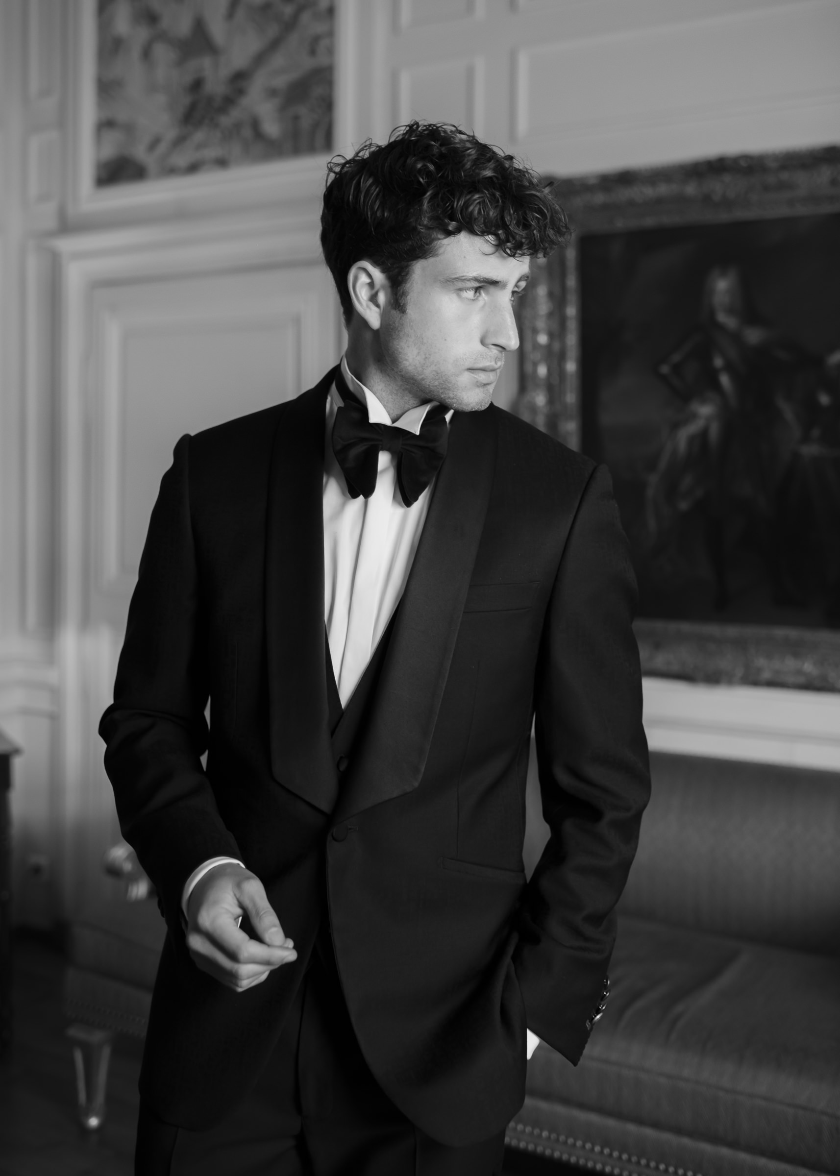 Refined groom portrait captured inside a historic French château
