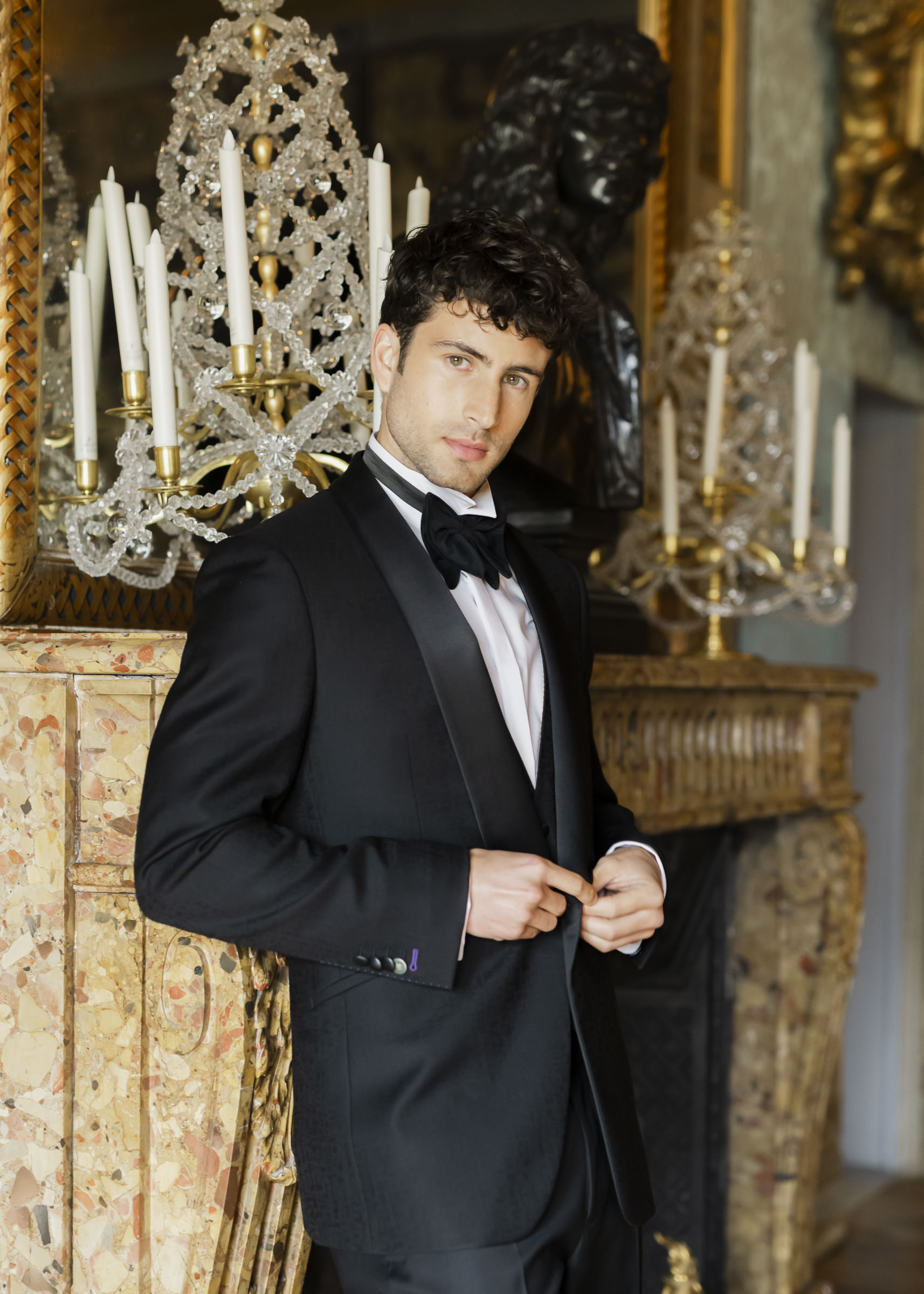 Refined groom portrait captured inside a historic French château