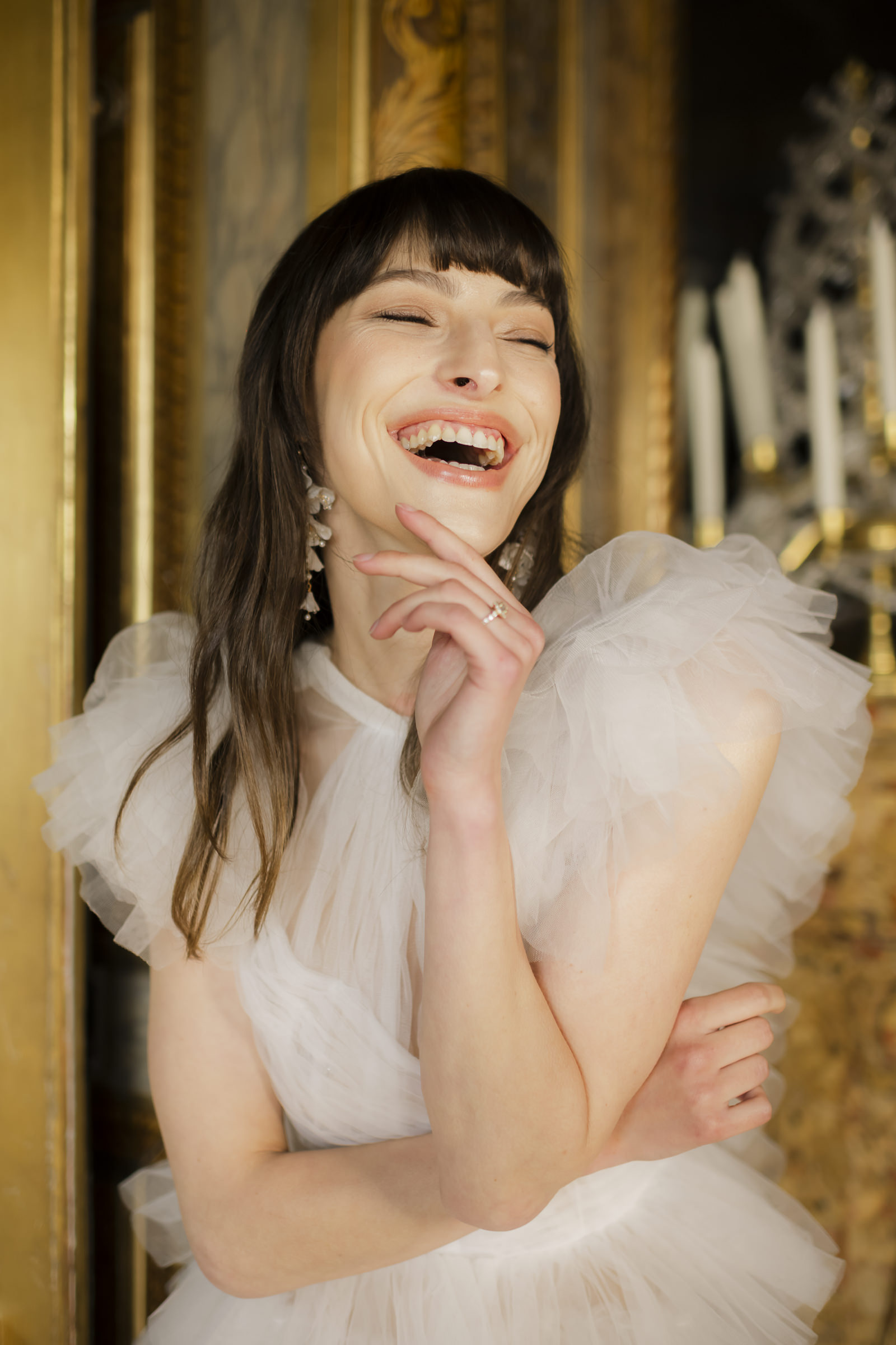 laughing bride wedding portrait set within a historic French château interior