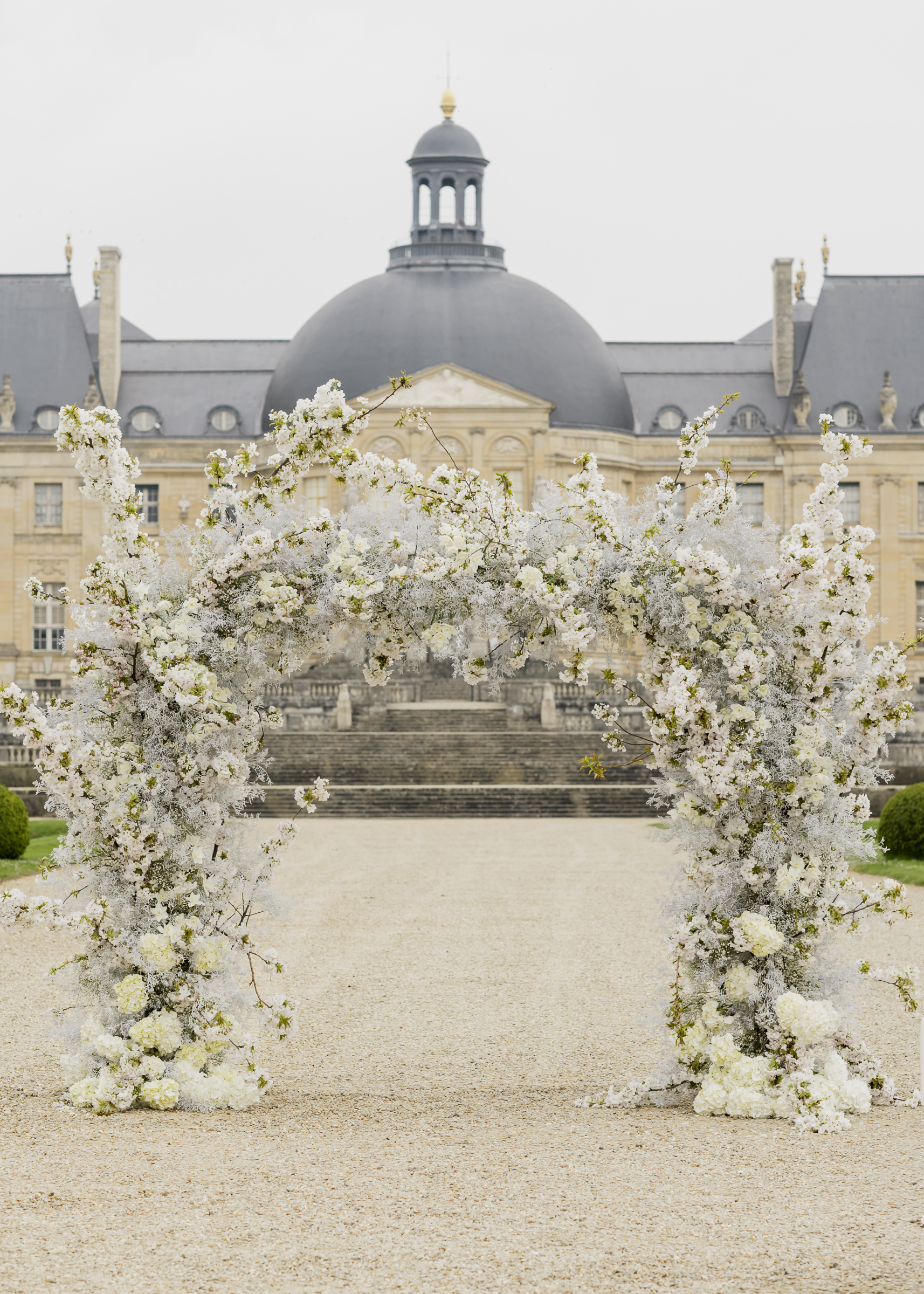 Luxury floral arch installation inspired by French architecture and couture fashion