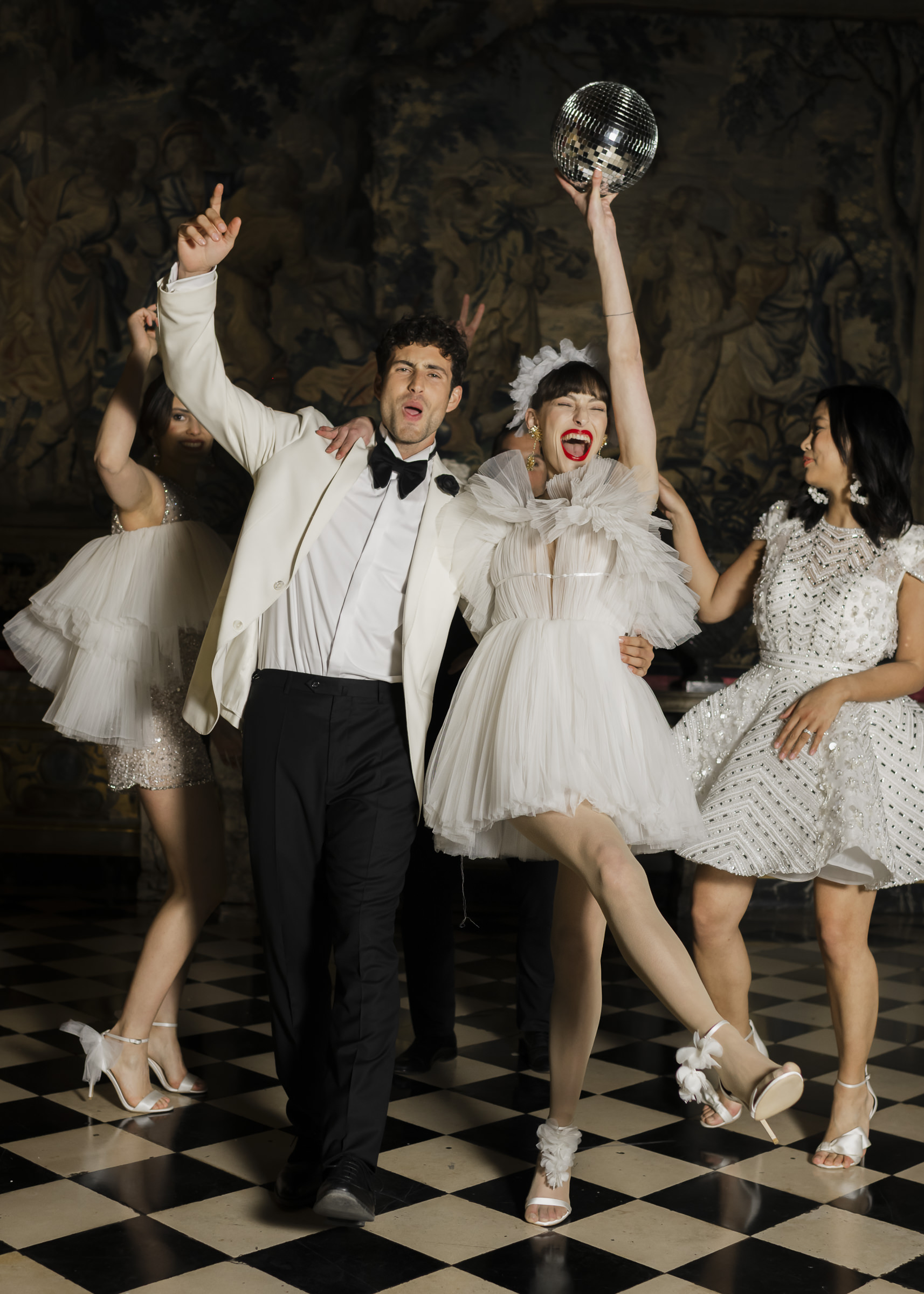 Elegant fun wedding reception atmosphere inside a historic French château near Paris