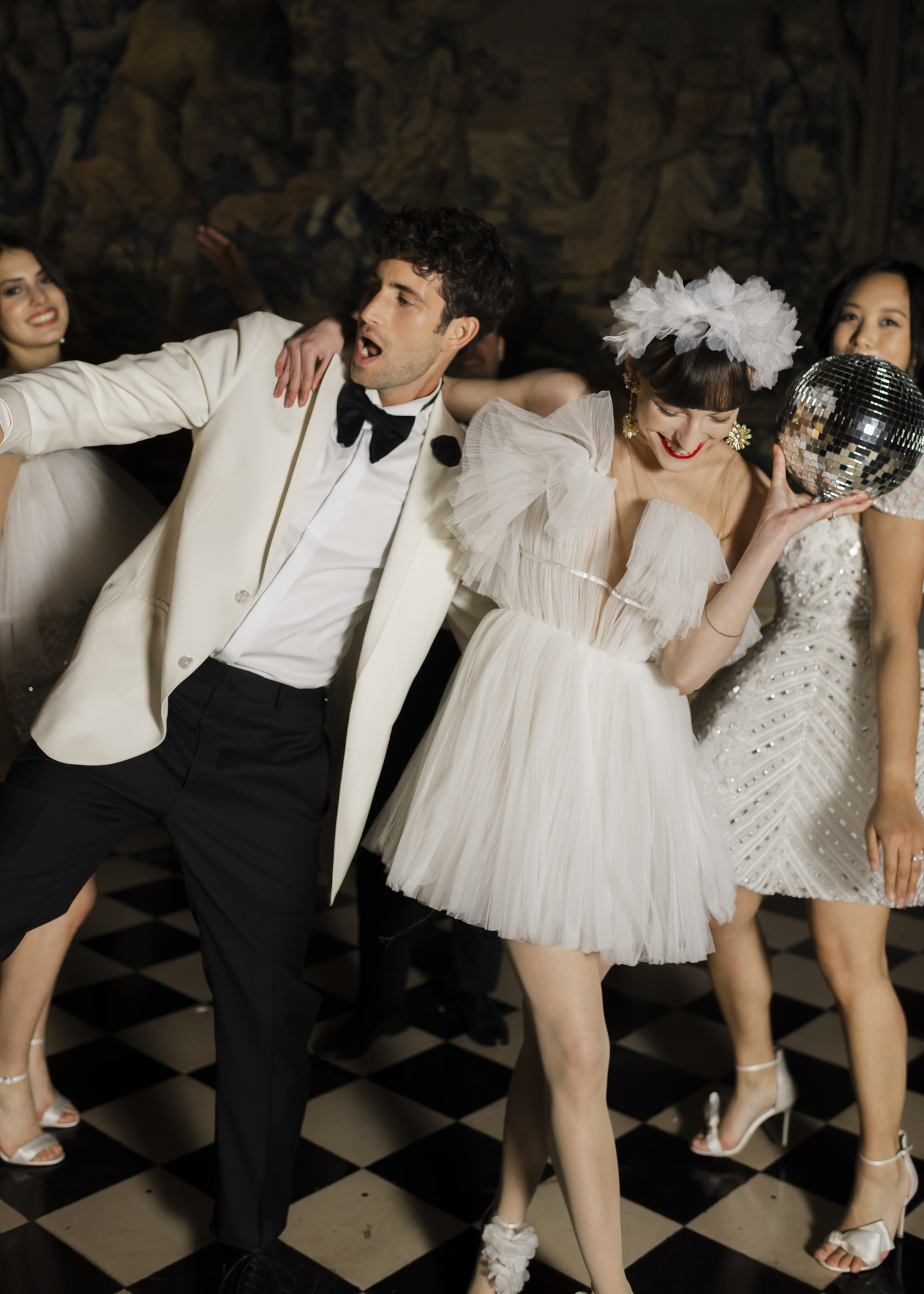 Luxury fun château wedding party as night falls at Vaux-le-Vicomte