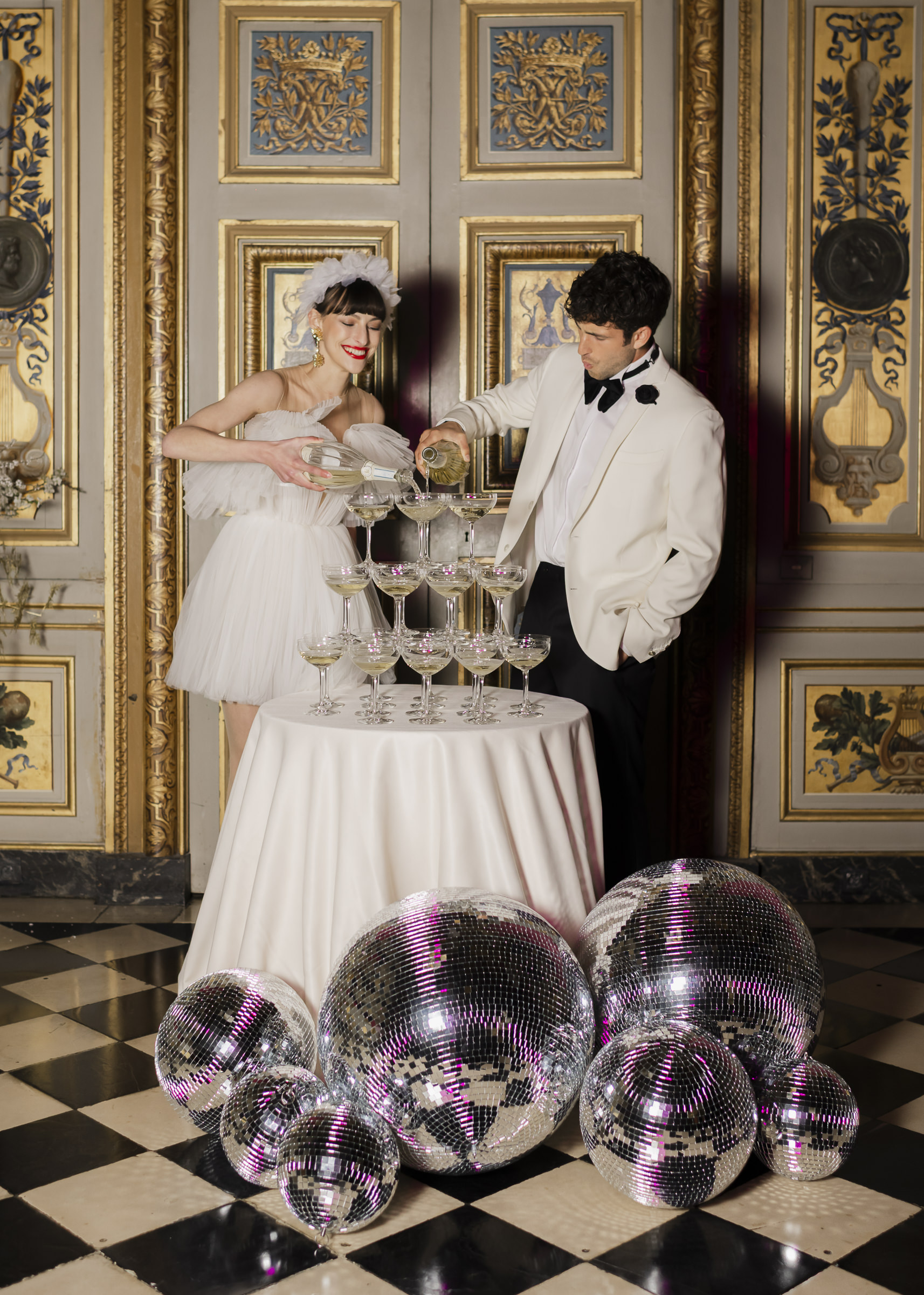 Champagne Tower moments with Bride and Groom, Luxury château wedding party as night falls at Vaux-le-Vicomte,