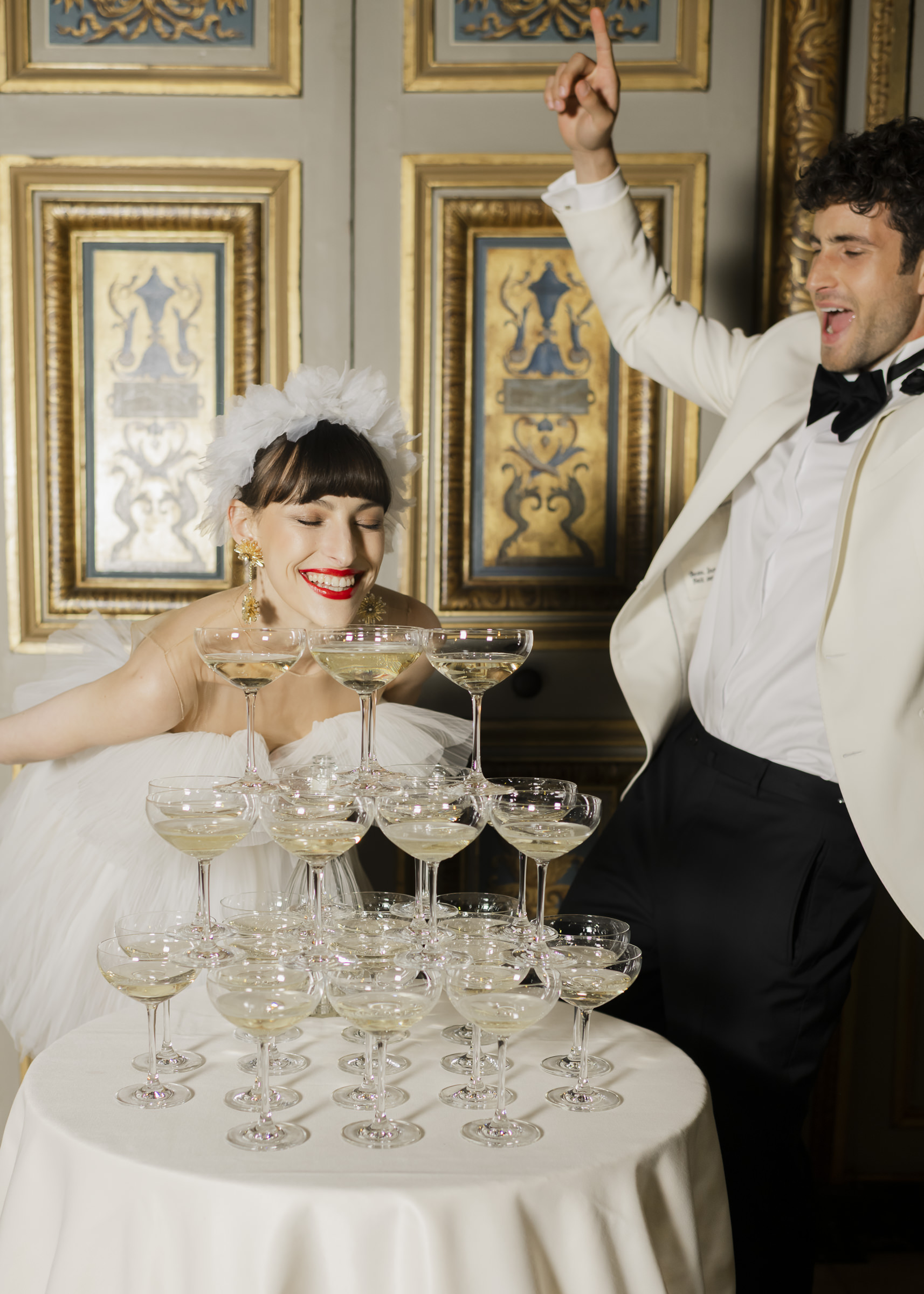 Luxury château wedding party as night falls at Vaux-le-Vicomte, Champagne Tower moments with Bride and Groom,