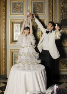 Luxury château wedding party as night falls at Vaux-le-Vicomte, Champagne Tower moments with Bride and Groom,