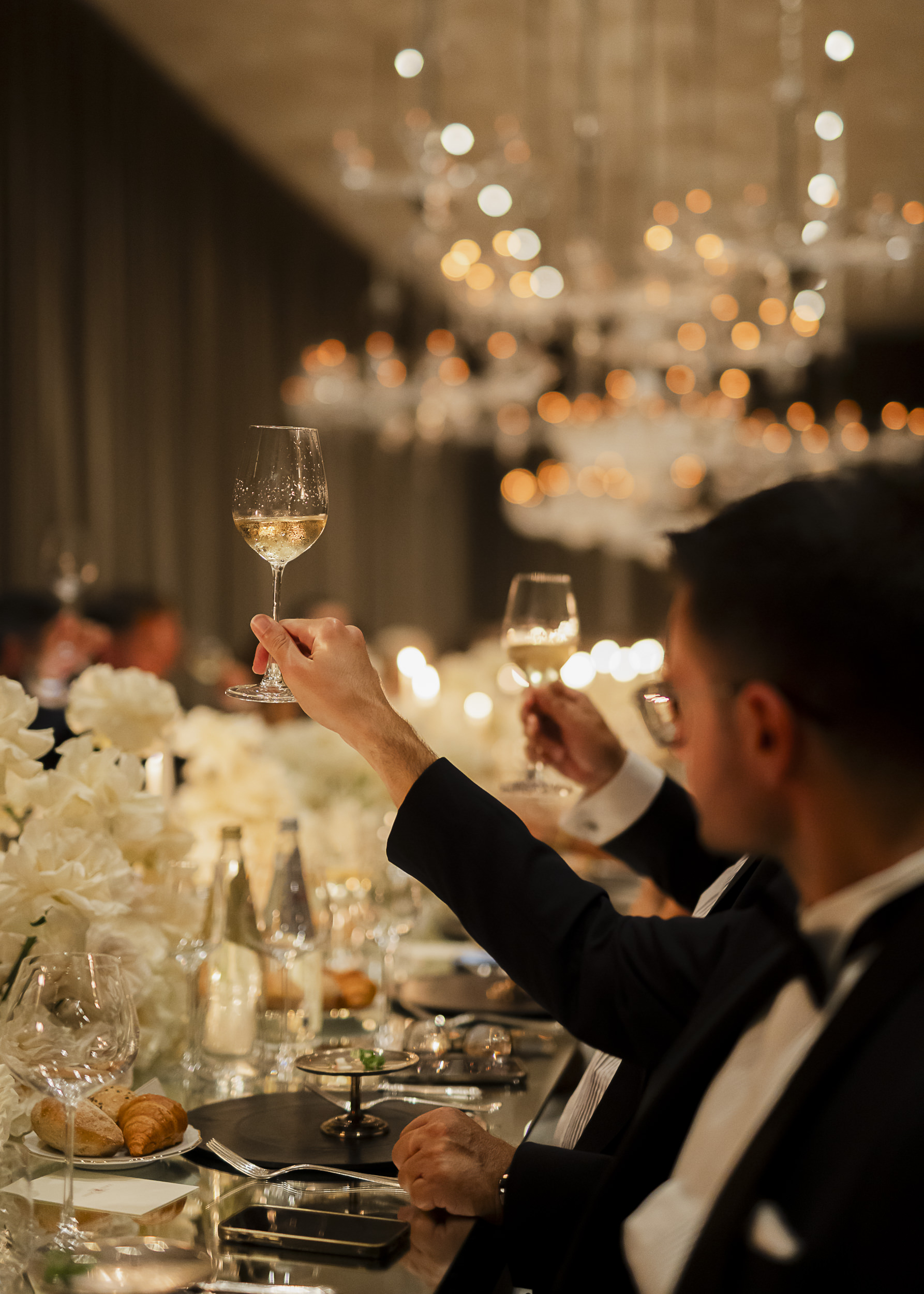 A toast to the guest of honour at a candlelit dinner next to the Grand Canal